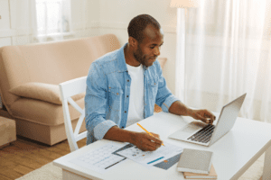 Cheerful self-employed man working from home