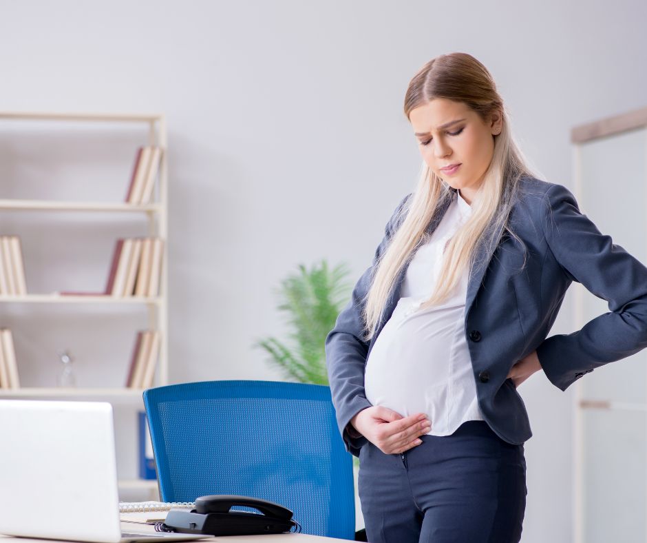 A pregnant woman standing